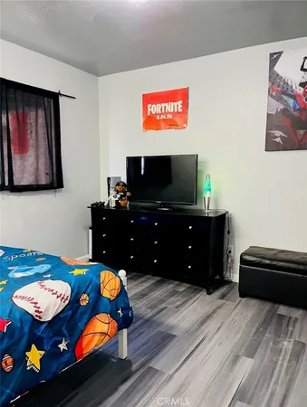 a living room with furniture and flat screen tv