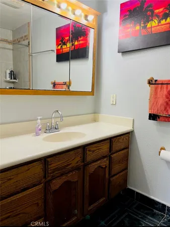 a bathroom with a sink and a mirror