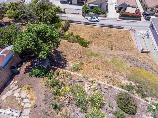 a aerial view of a house with a yard and garden