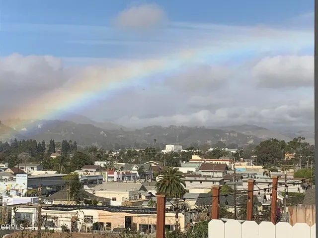 a view of a city with mountains in the background