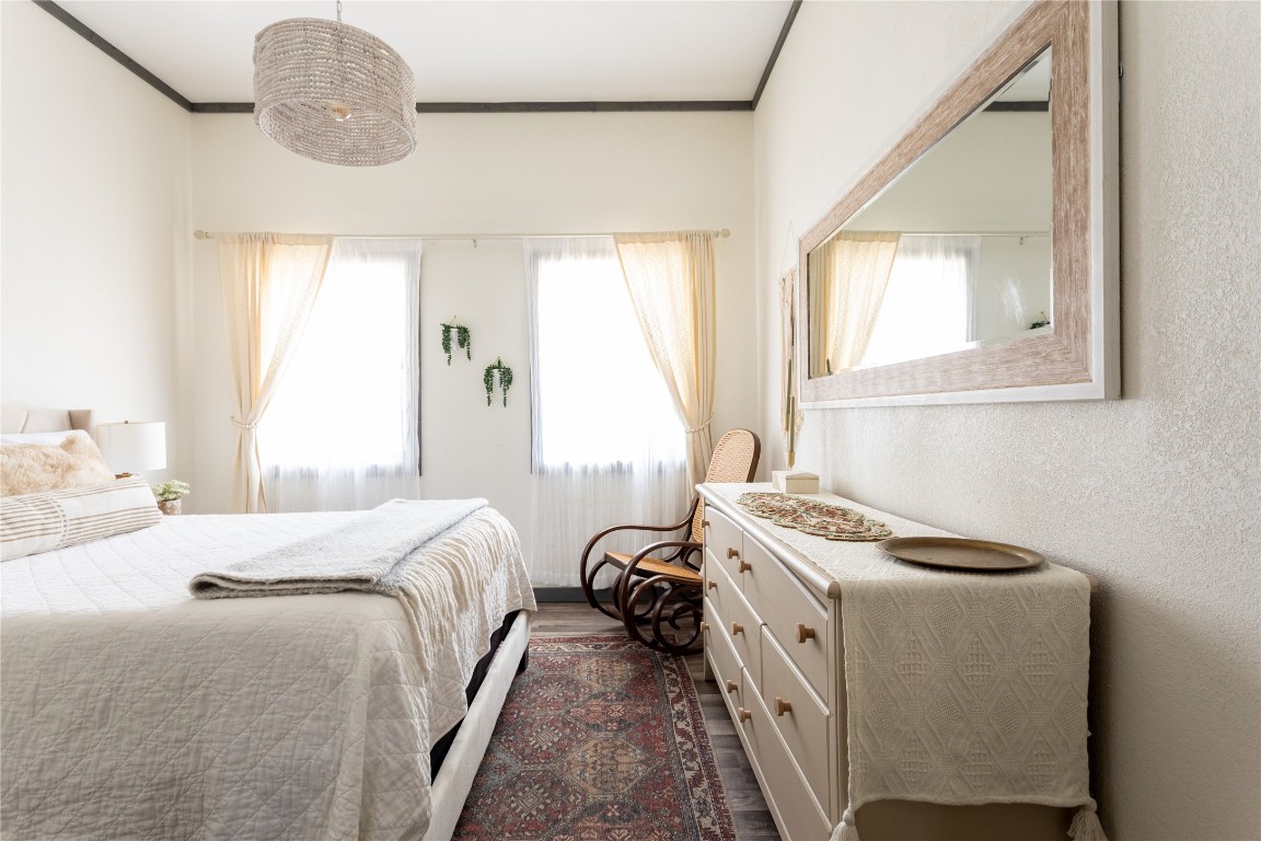 336 Coventry Road Spicewood, TX 78669 - Photo 17 of 32 a bedroom with a bed and a window