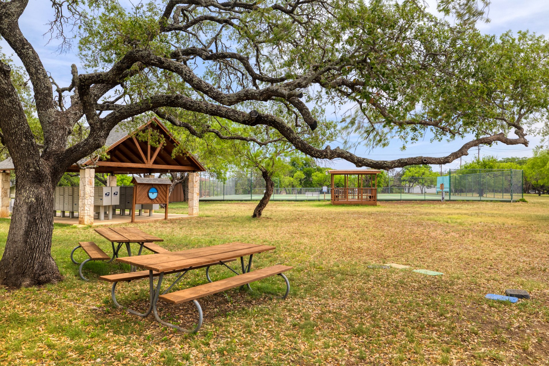 336 Coventry Road Spicewood, TX 78669 - Photo 32 of 32 View of home's community featuring mail area and a patio