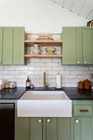 a kitchen with a sink and cabinets