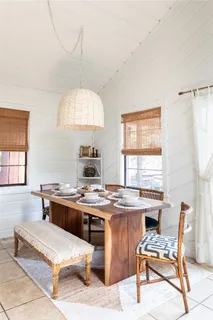 a room with a table chairs and a dining table