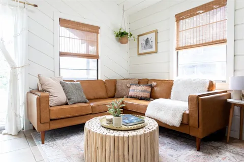 a living room with furniture and a window