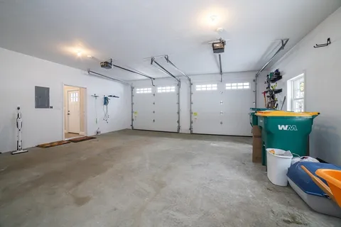a view of a room with furniture and windows