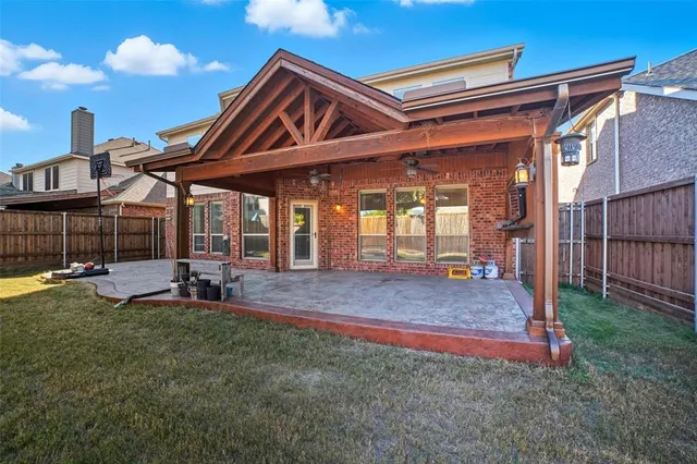 a view of an house with backyard porch and furniture