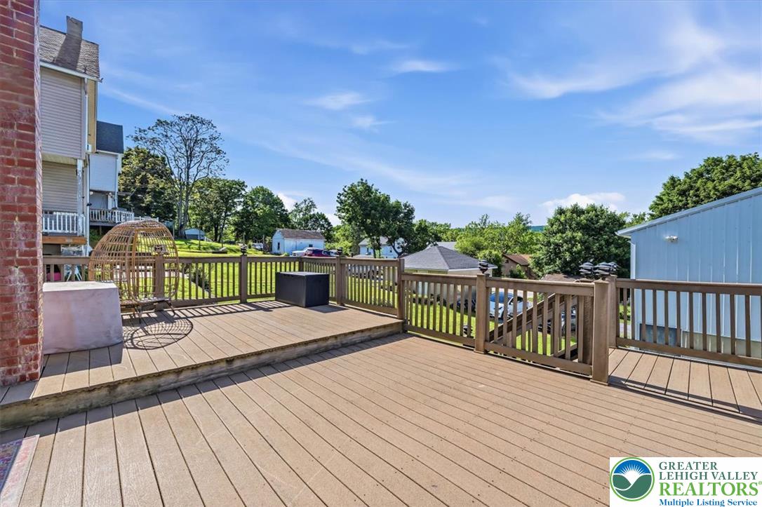 3453 Main Street Slatington, PA 18080 - Photo 20 of 30 A spacious outdoor deck with wood railings offers ample room for relaxation and entertainment.