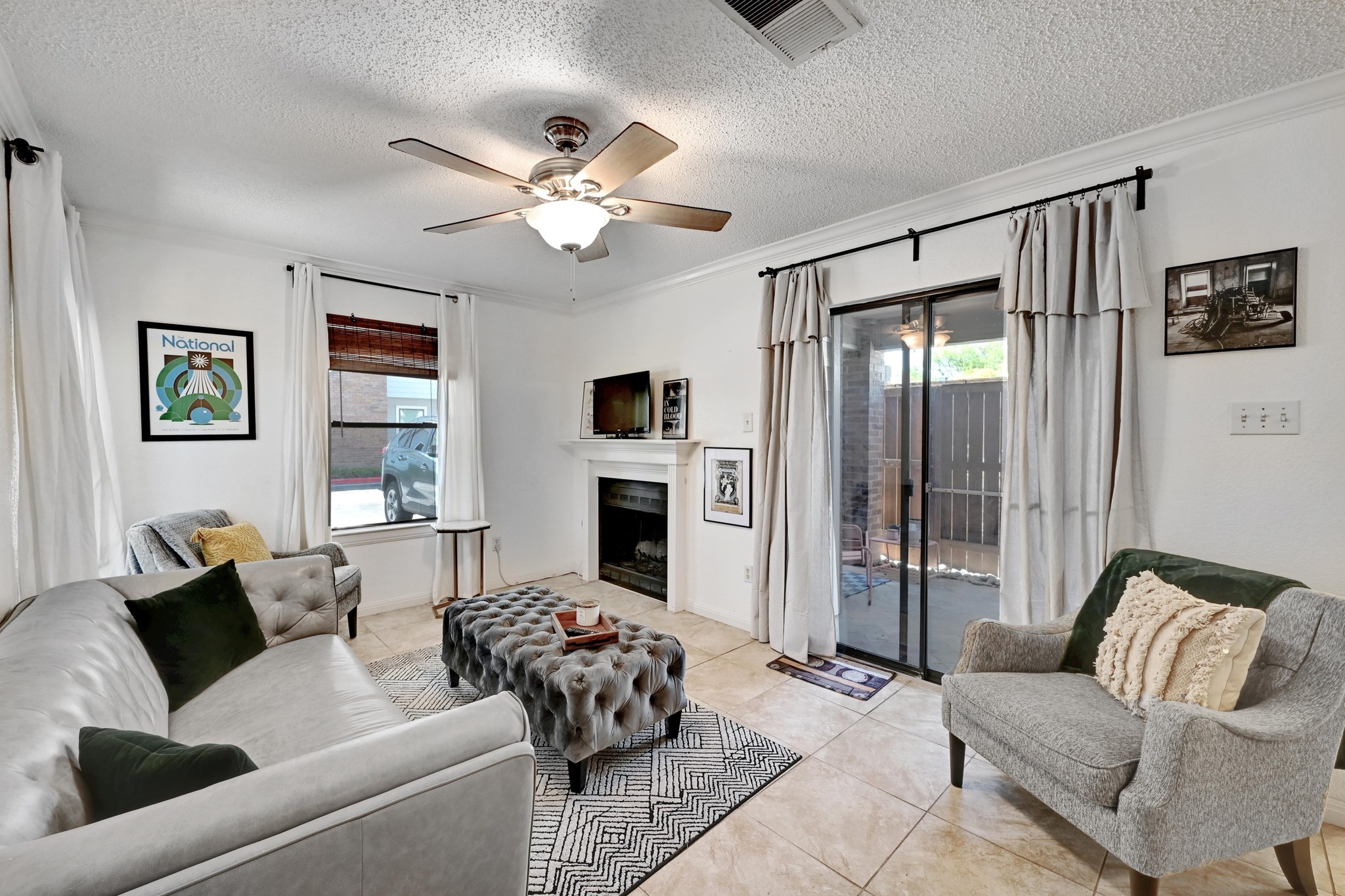 7635 Guadalupe Street, Unit 1002 Austin, TX 78752 - Photo 6 of 27 a living room with furniture and a fireplace