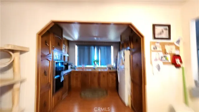 a kitchen with stainless steel appliances granite countertop a sink and cabinets