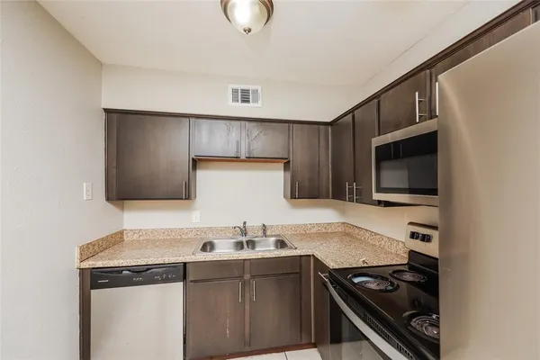 a kitchen with a stove and a microwave