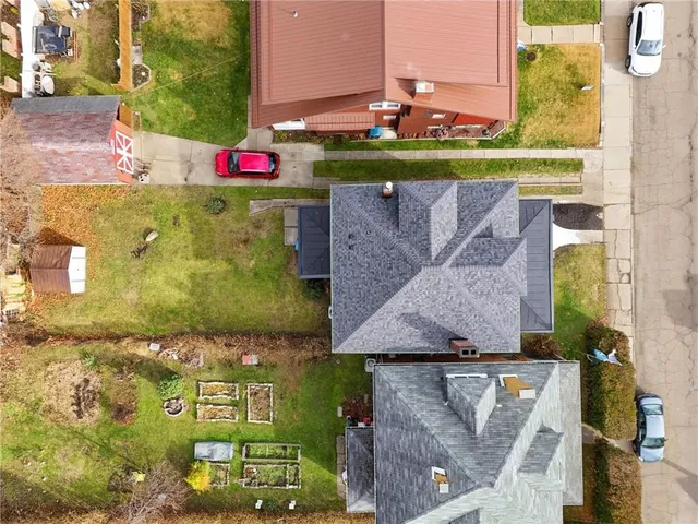 an aerial view of residential houses with city view