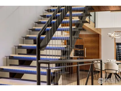 a living room with furniture and a mirror