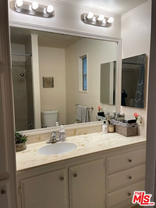 11250 Beach Boulevard, Unit 10 Stanton, CA 90680 - Photo 17 of 24 a bathroom with a sink double vanity and a mirror