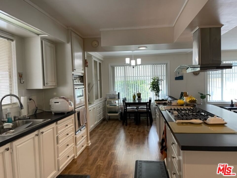 11250 Beach Boulevard, Unit 10 Stanton, CA 90680 - Photo 5 of 24 a kitchen with a stove a sink and a refrigerator