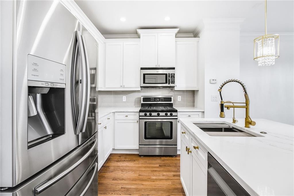 13 High Top Road Sandy Springs, GA 30328 - Photo 16 of 34 a kitchen with stainless steel appliances granite countertop a refrigerator and a stove top oven