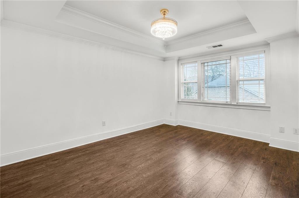 13 High Top Road Sandy Springs, GA 30328 - Photo 19 of 34 an empty room with wooden floor and windows