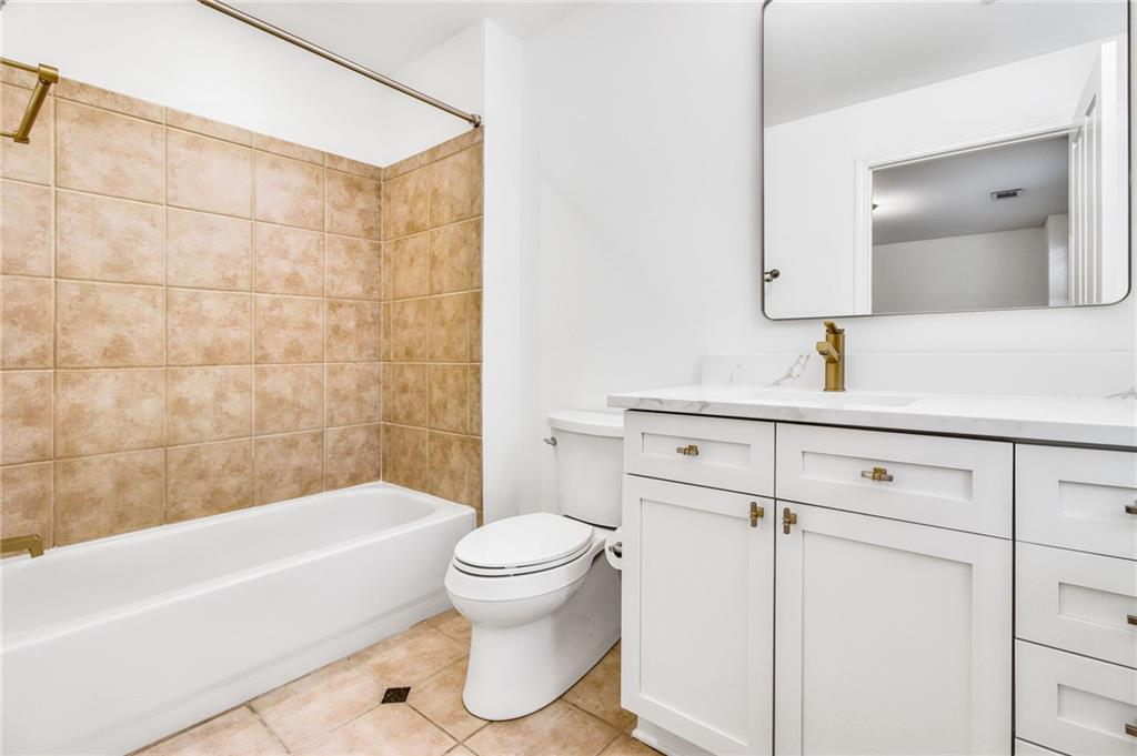 13 High Top Road Sandy Springs, GA 30328 - Photo 25 of 34 a bathroom with a sink toilet and shower