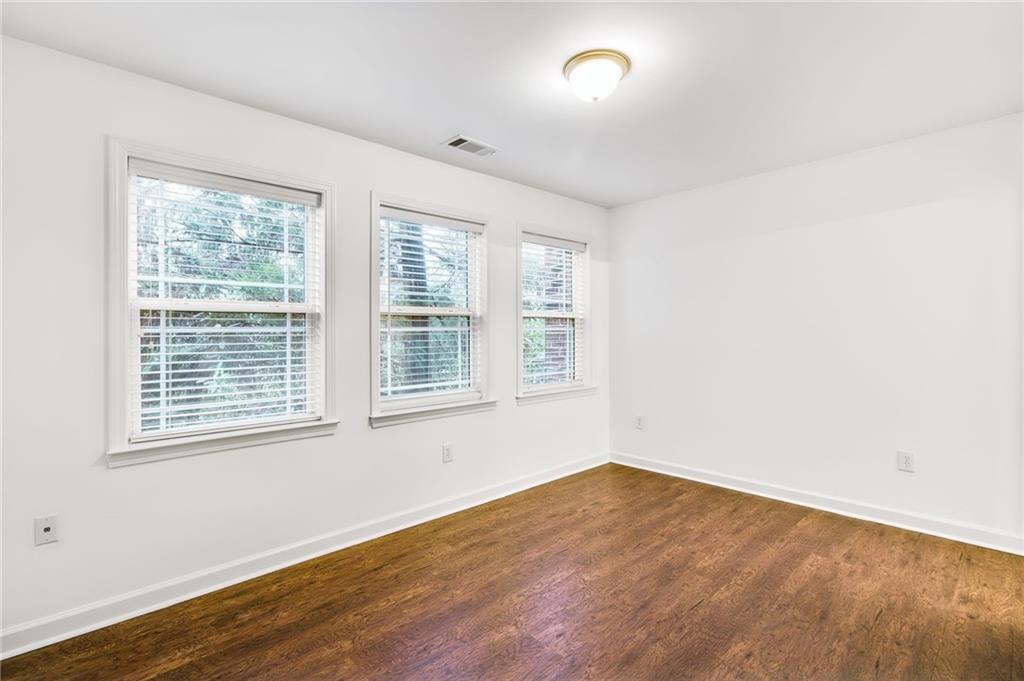 13 High Top Road Sandy Springs, GA 30328 - Photo 27 of 34 an empty room with wooden floor and windows