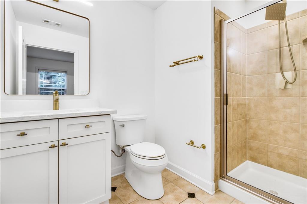 13 High Top Road Sandy Springs, GA 30328 - Photo 28 of 34 a bathroom with a toilet a sink and shower