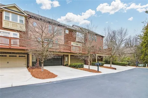 a view of a house with basketball court
