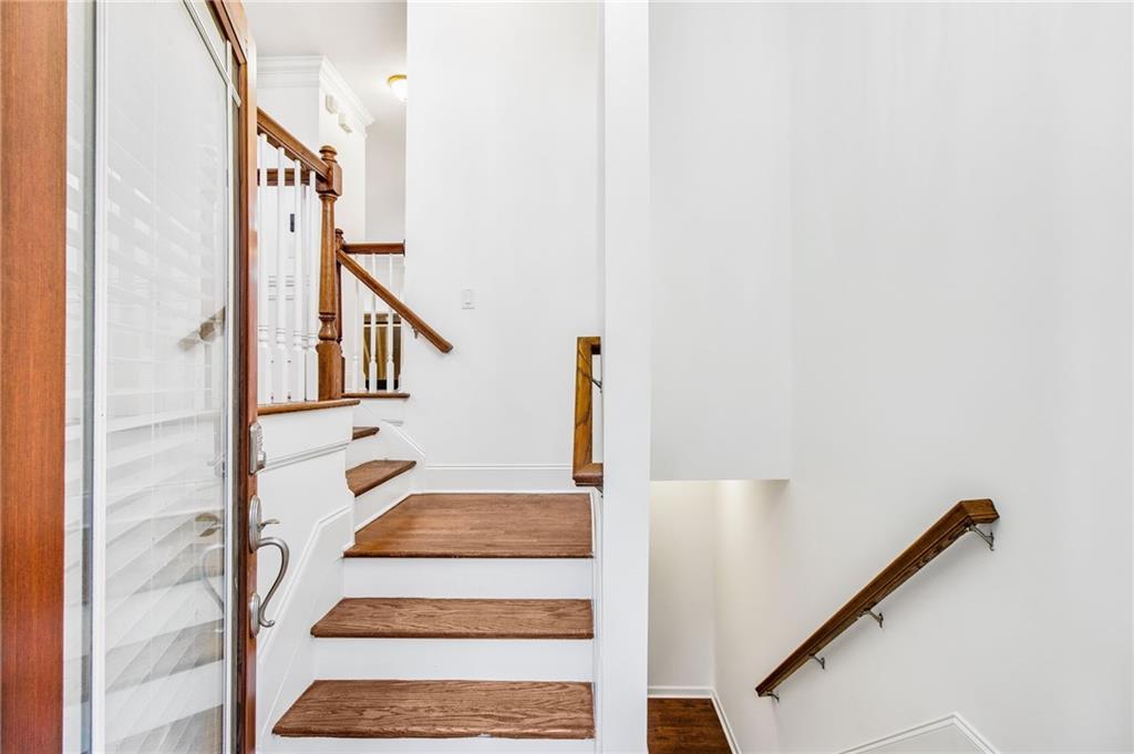 13 High Top Road Sandy Springs, GA 30328 - Photo 4 of 34 a view of staircase with white walls and a window