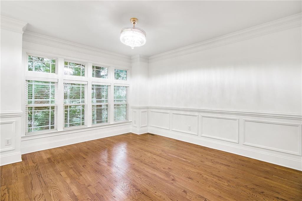 13 High Top Road Sandy Springs, GA 30328 - Photo 5 of 34 a view of an empty room with wooden floor and a window