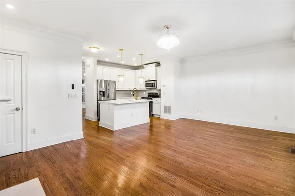 a view of kitchen with wooden floor
