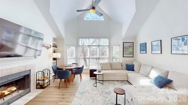 a living room with furniture and a fireplace