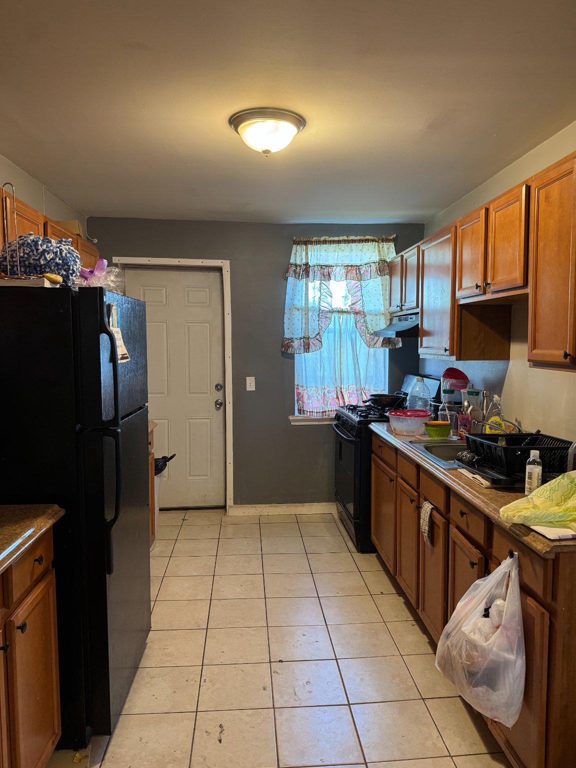 3908 Fairfax Road Baltimore, MD 21216 - Photo 5 of 24 Cozy kitchen with warm wooden accents.