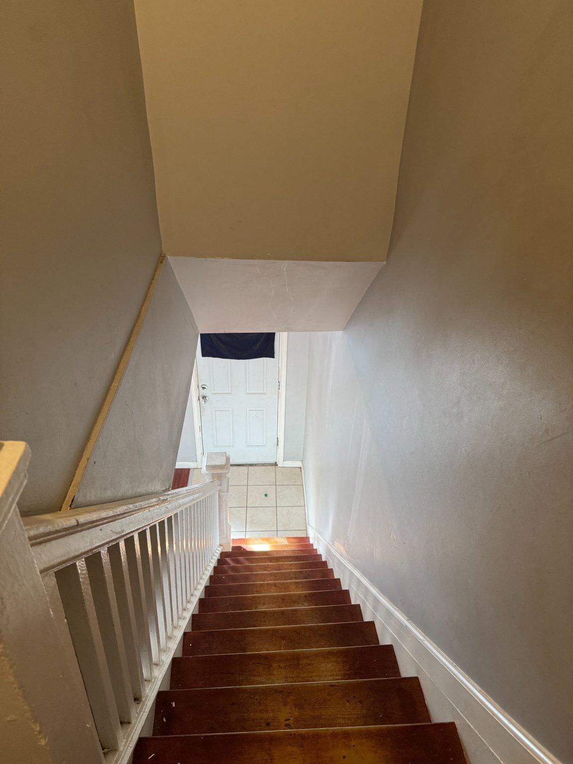 3908 Fairfax Road Baltimore, MD 21216 - Photo 9 of 24 Welcoming descent to the heart of home.