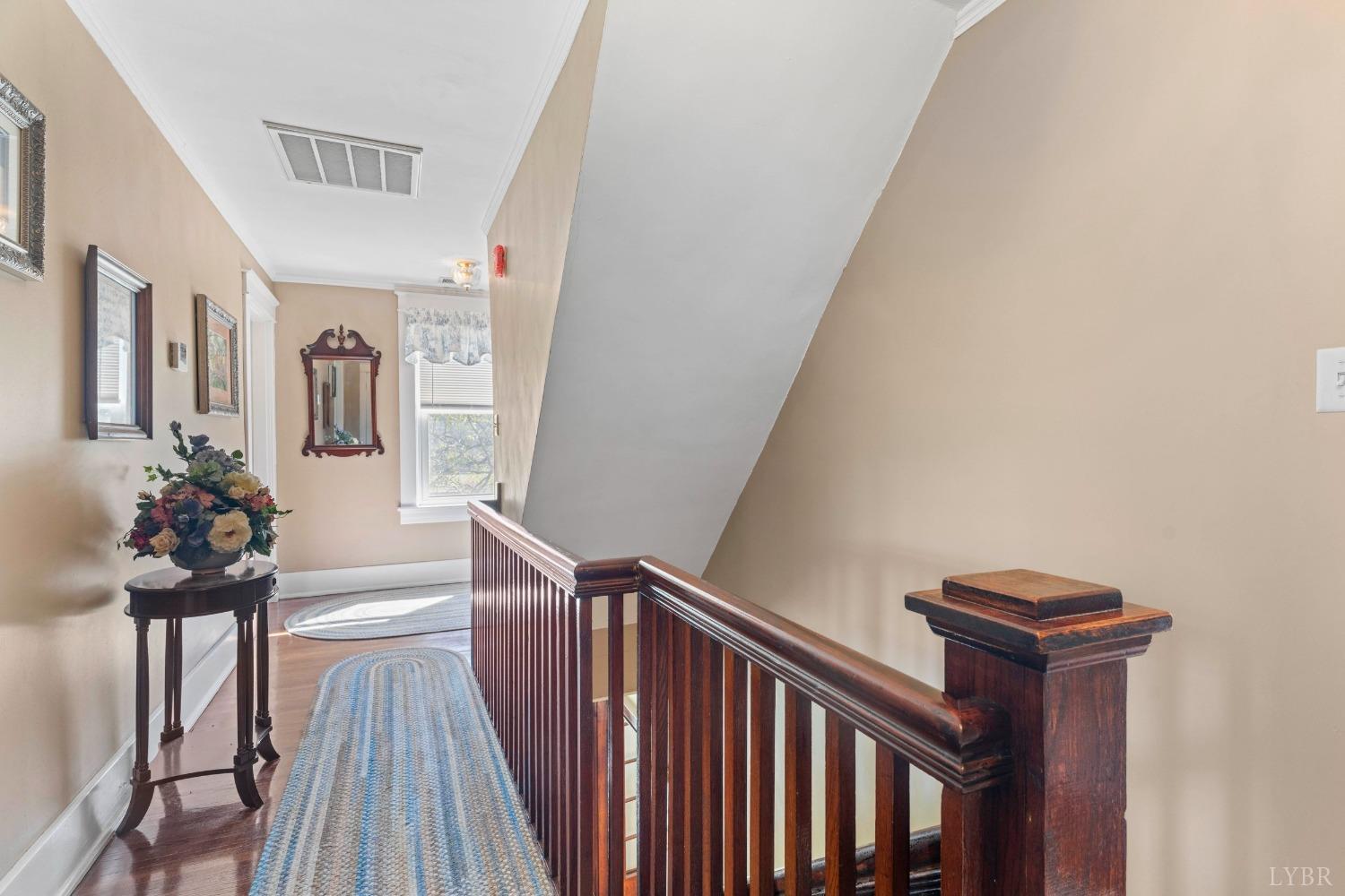1876 Dickie Road Roseland, VA 22967 - Photo 30 of 75 a view of a hallway with wooden floor and stairs