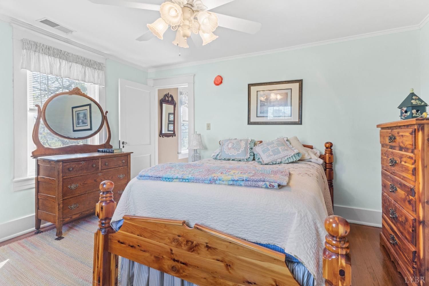 1876 Dickie Road Roseland, VA 22967 - Photo 39 of 75 a bedroom with a bed and a chandelier