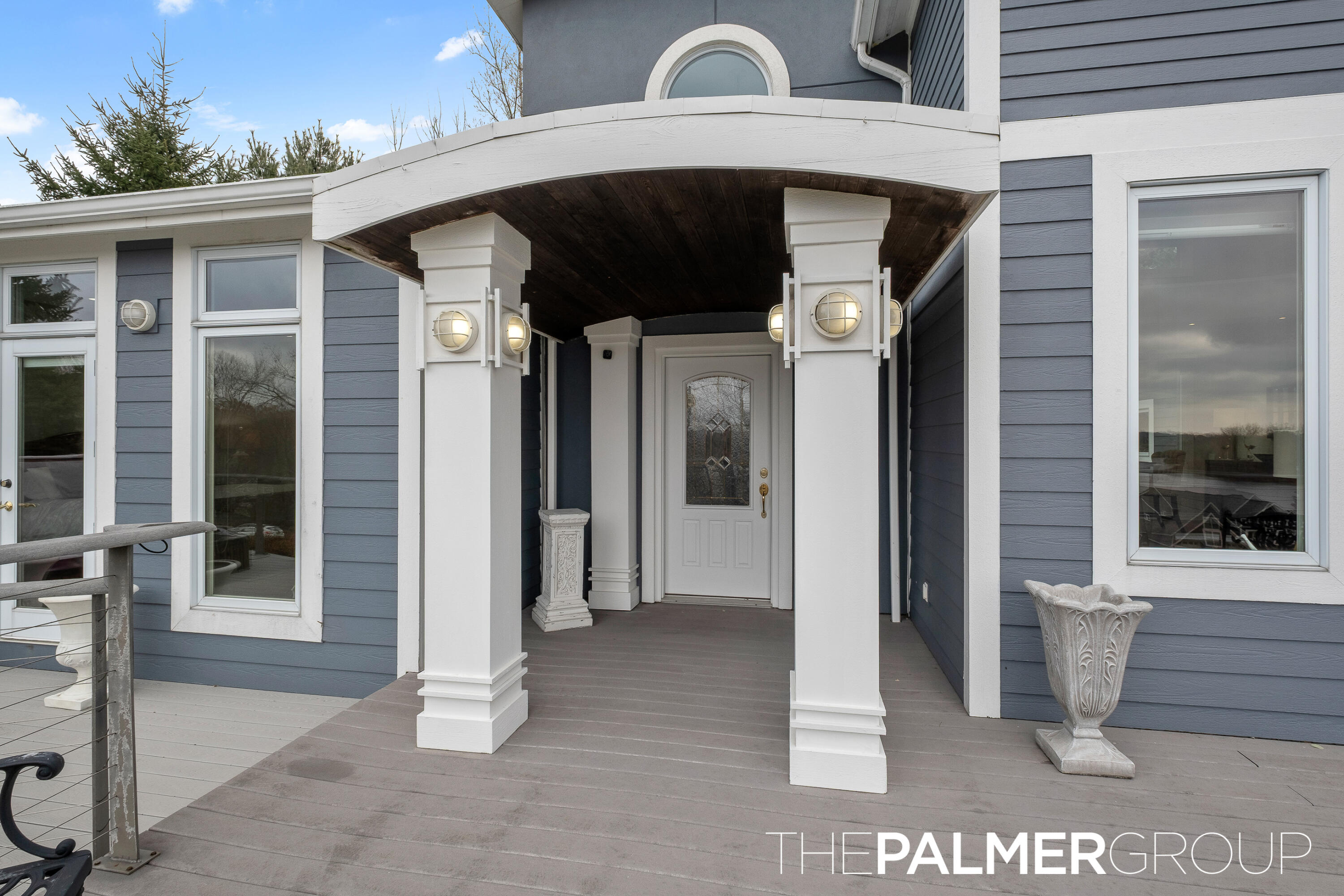 11864 5 Mile Road Northeast Lowell, MI 49331 - Photo 41 of 59 Grand Covered Deck Entrance