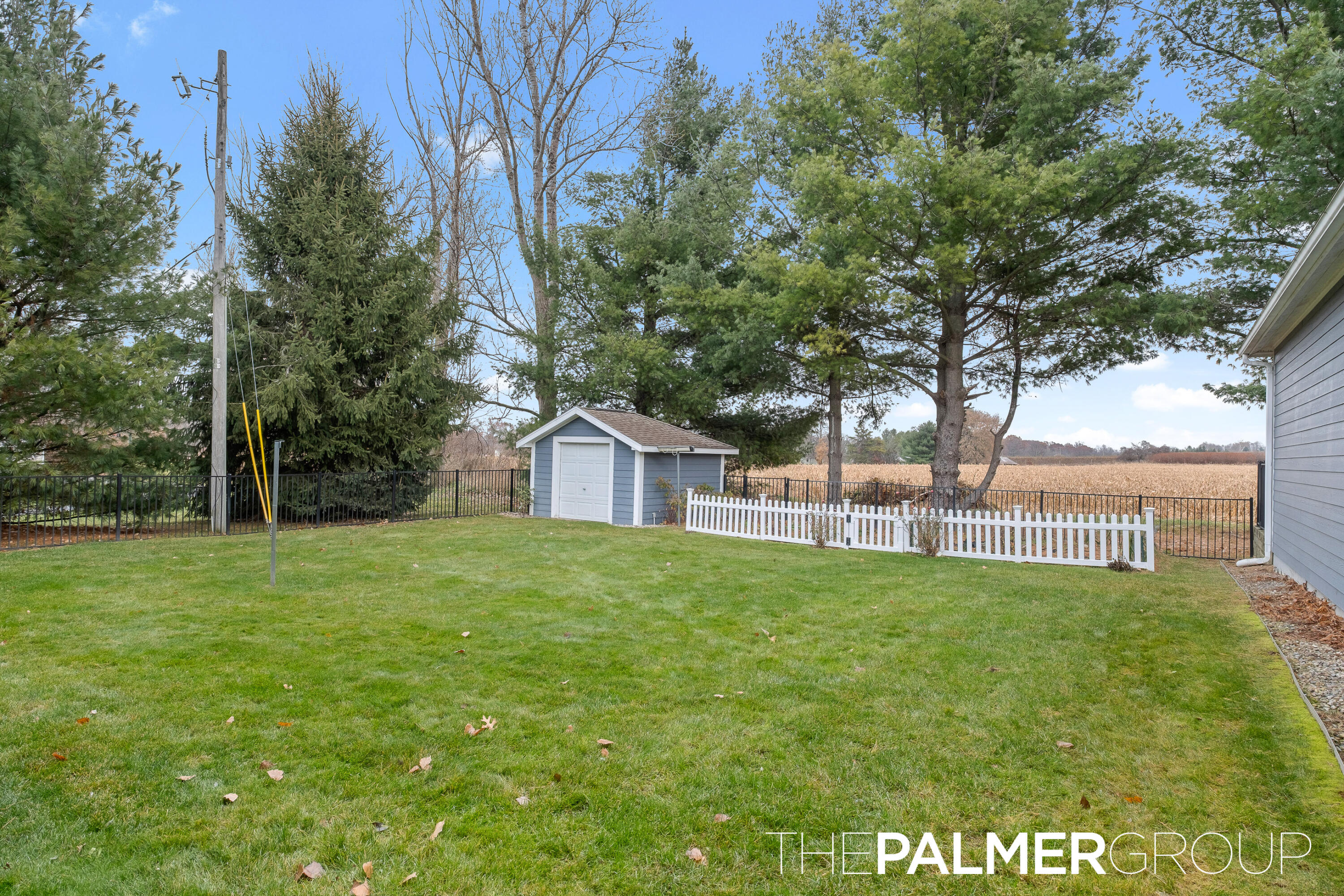11864 5 Mile Road Northeast Lowell, MI 49331 - Photo 45 of 59 Fenced Backyard with Shed