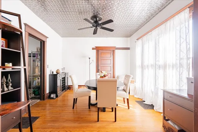 a view of a dining room with furniture and a window