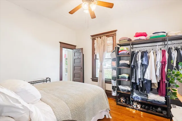 a bed room with a bed and a window