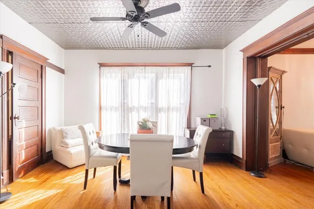 a view of a dining room with furniture window and wooden floor
