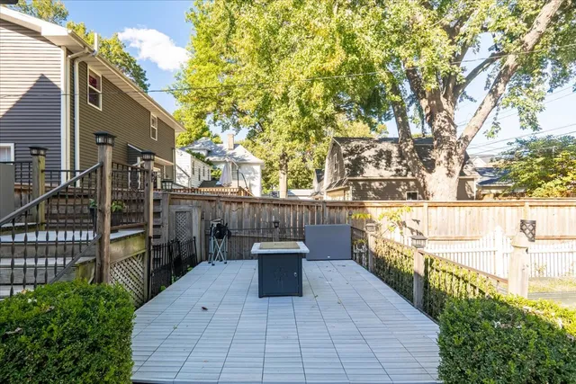 a view of a balcony with wooden fence