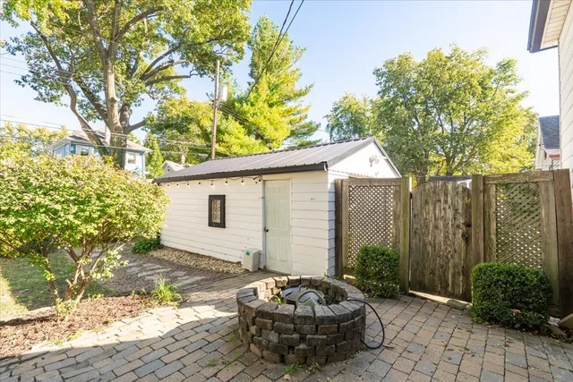 a view of a porch with furniture and a fire pit