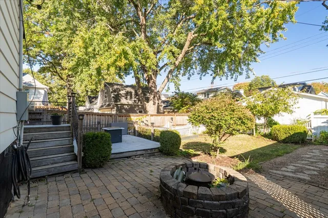 a front view of a house with a fountain