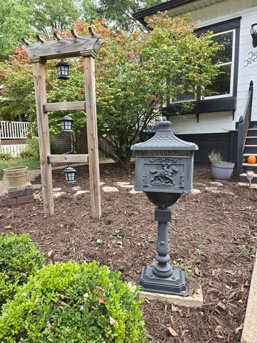 a view of a balcony with wooden floor and iron stairs