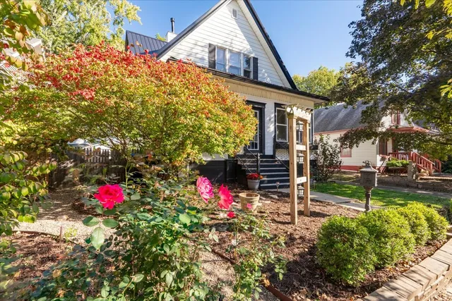 a front view of a house with garden