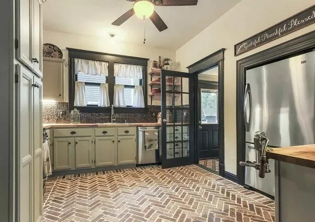 a bathroom with a granite countertop sink a mirror and a shower