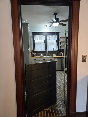 a kitchen with a sink and cabinets