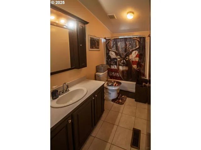 a bathroom with a sink a mirror and a bathtub