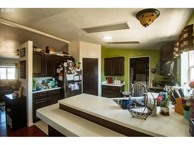 a view of a dining room with furniture wooden floor and chandelier