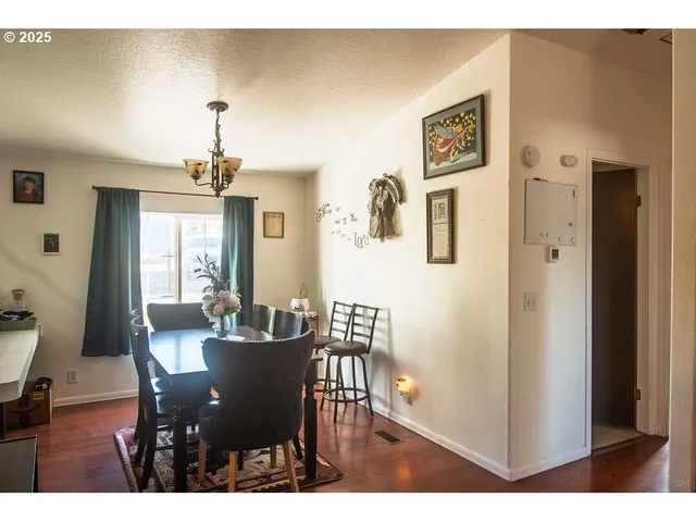 a bedroom with a bed closet and flat tv screen