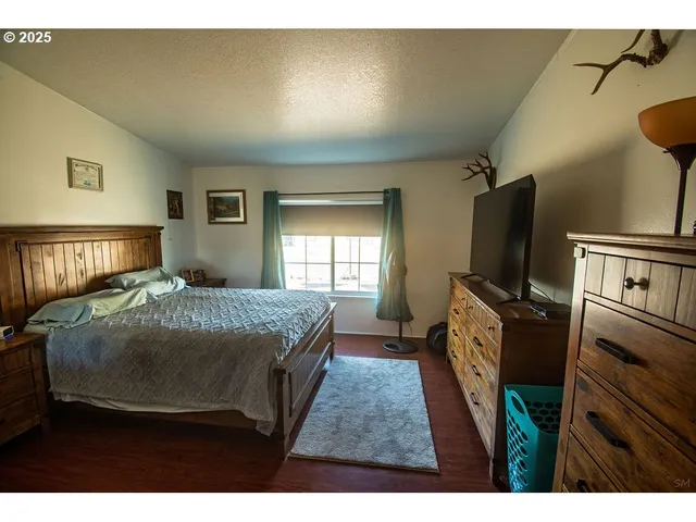 a view of walk in closet with clothes