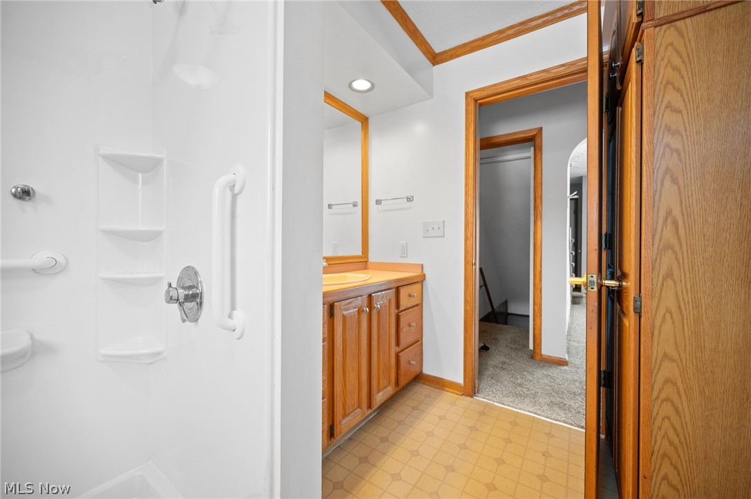 2099 Pontius Road Mogadore, OH 44260 - Photo 35 of 35 Full bathroom featuring vanity, light floors, crown molding, a shower, and recessed lighting